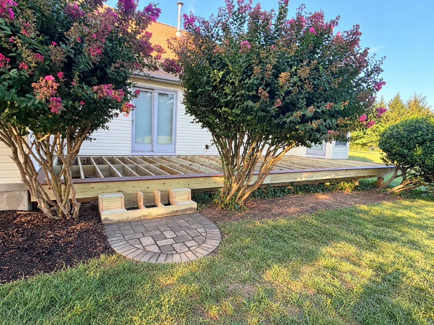Before decking: exposed joists and unfinished steps