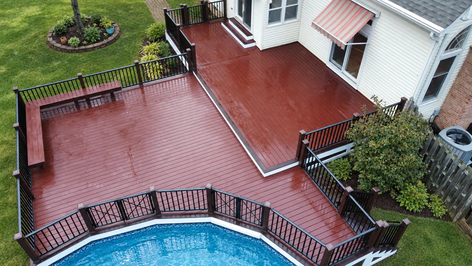 Overhead view of a broad deck with separate outdoor seating areas — Zenna Decks portfolio
